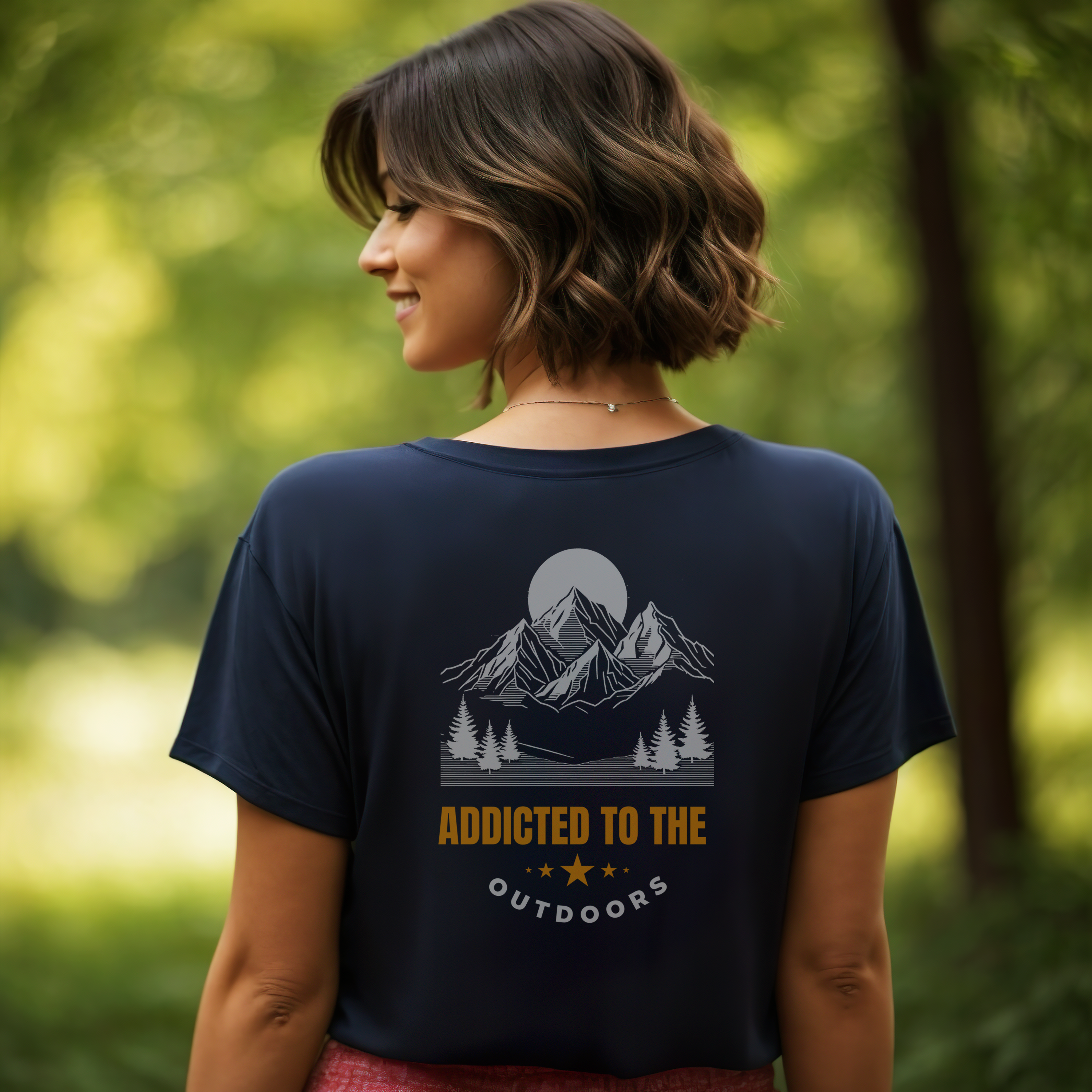 Women's cotton* Navy Addicted To The Outdoors T-Shirt in a forest setting. Ethically sourced clothing